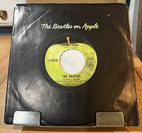 Front view of 7" record in black Beatles on Apple company sleeve