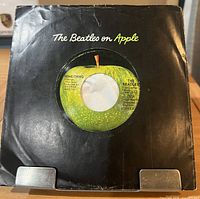 Front view showing vinyl within original black Beatles on Apple sleeve