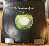 Front of company sleeve displaying record through center hole