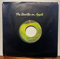 Record in black company sleeve showing front label window