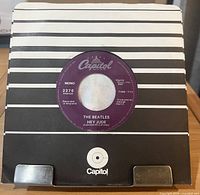 Record in company sleeve front view