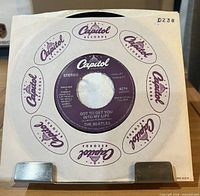 Front view showing record in Capitol company sleeve