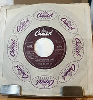 Record in Capitol dome logo sleeve, blank center hole visible