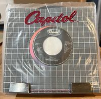 Record in Capitol grid stock sleeve inside poly outer sleeve