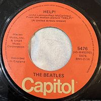 Side A label showing Help on orange Capitol label