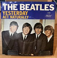 Front side of Beatles Capitol 5498 picture sleeve showing song order "Yesterday" over "Act Naturally", visible wear