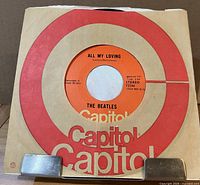 Front view of vinyl in Capitol target sleeve showing label through center cutout