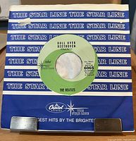 Front view of 7-inch Beatles Capitol Starline single in blue Starline sleeve