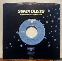 Front of record in Super Oldies picture sleeve showing label through center hole