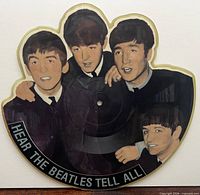 Front of shaped picture disc featuring colour Beatles image