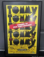 Framed signed yellow Tommy poster