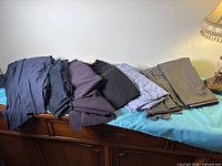 All folded fabric pieces laid on dresser