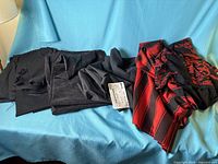 Overview of all fabric pieces laid out on blue surface