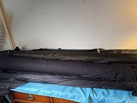 Multiple black fabric bolts on surface