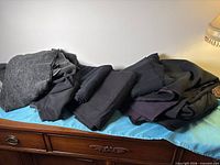 All fabric pieces piled on dresser