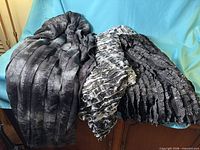 All three black ruffle fabric pieces draped together