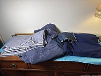 Overview showing three fabric pieces stacked on dresser