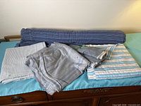 All five fabric pieces including rolled bolt and folded cuts