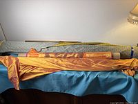 All three fabric bolts laid out on surface.