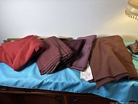 All four fabric pieces laid out on surface
