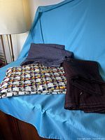 All three fabric pieces folded on chair