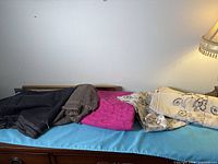 All four fabric pieces folded on a surface