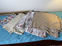 Four fabric pieces laid out showing variety