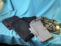 All four folded fabric pieces displayed