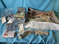 Overview of entire lot showing assorted buttons in bags, on cards and loose, plus two small decorative boxes