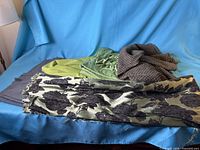 All four fabric pieces displayed together on blue backdrop