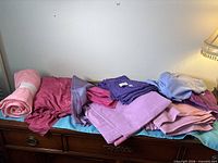 All six fabric pieces displayed on dresser top