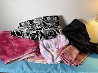 Stack of assorted plush fabrics showing colours and textures