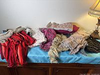 Overview of mixed fabric remnants on table