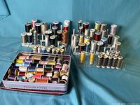 Overview of spools on racks and in metal tin