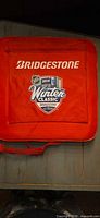Red side of cushion with Bridgestone logo