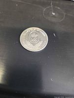 Obverse with shield, Olympic rings and legend