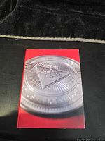 Front of booklet showing enlarged coin image