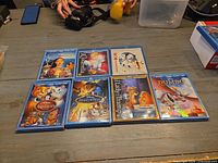 All seven Disney Blu-ray + DVD combo cases laid out on table