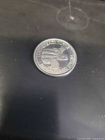 Obverse showing rhinoceros profile and text