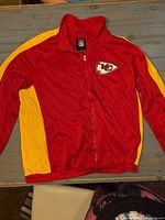 Front view of red/yellow Kansas City Chiefs full-zip jacket