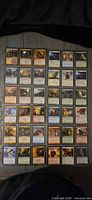 Front view of all 35 Magic: The Gathering cards laid out in 7 rows of 5 showing artwork, colours and duplicates