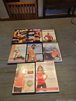 Overview of all eight DVD cases on table