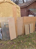 All sheets leaning against shed and canopy