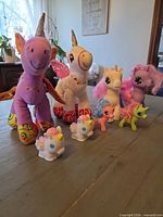 Group shot of all unicorn and pony toys on table