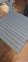 Top view showing gray aluminum slat surface
