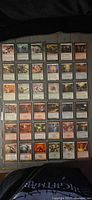 Single binder page displaying 36 individual Magic: The Gathering cards