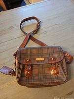 Full view of the Polo Ralph Lauren plaid crossbody bag showing front, strap, and overall condition