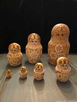 Full set of seven nesting dolls displayed in size order