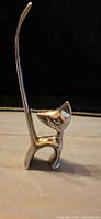 Full view of cat ring holder standing upright