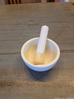 mortar with pestle resting inside